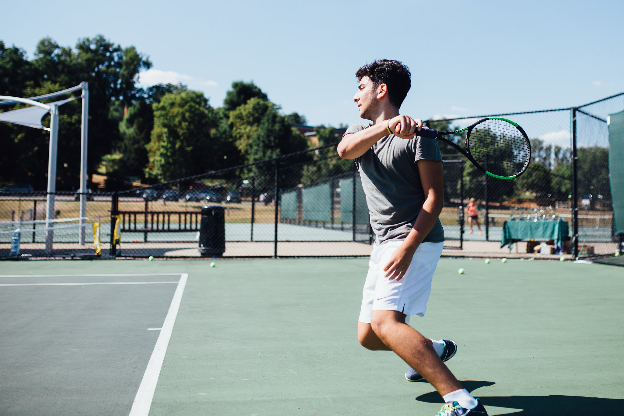 A student at Harrow Summer School playing tennis