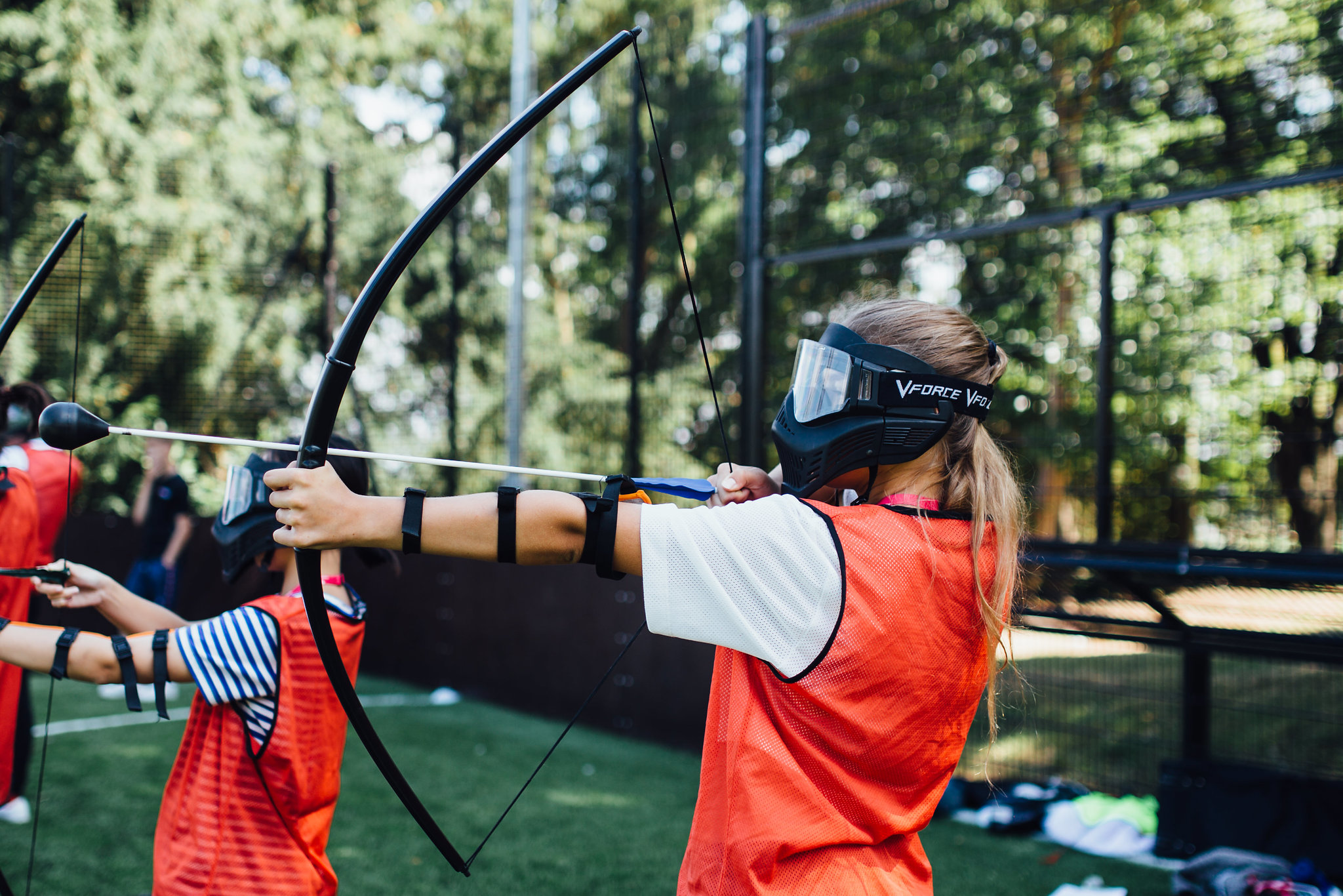 A girl tries archery at Harrow School Summer School